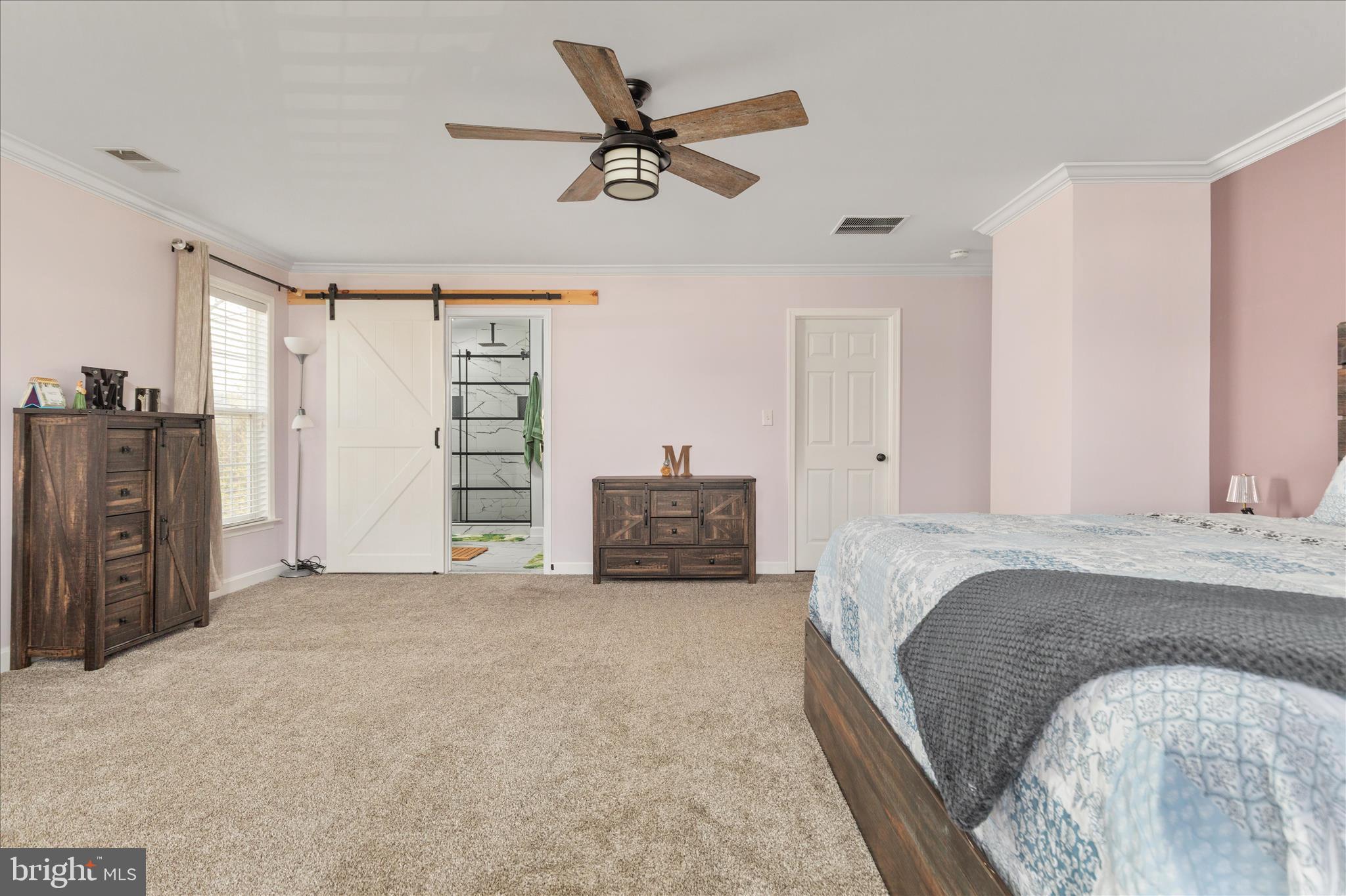 1161 Happy Ridge Drive Front Royal, VA 22630 - Photo 22 of 49 a spacious bedroom with a bed and a ceiling fan
