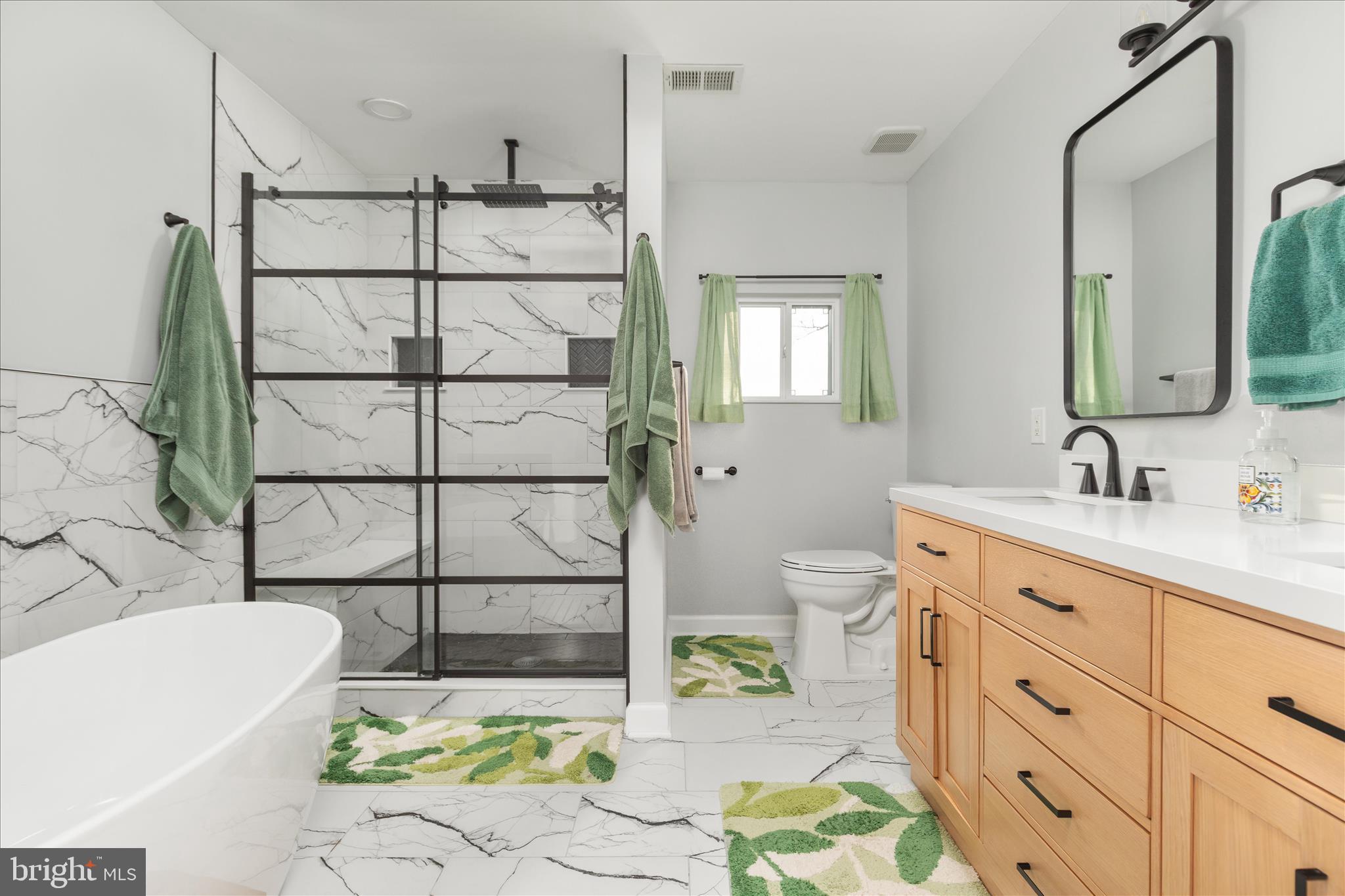 1161 Happy Ridge Drive Front Royal, VA 22630 - Photo 23 of 49 a spacious bathroom with a double vanity sink a mirror and a bathtub