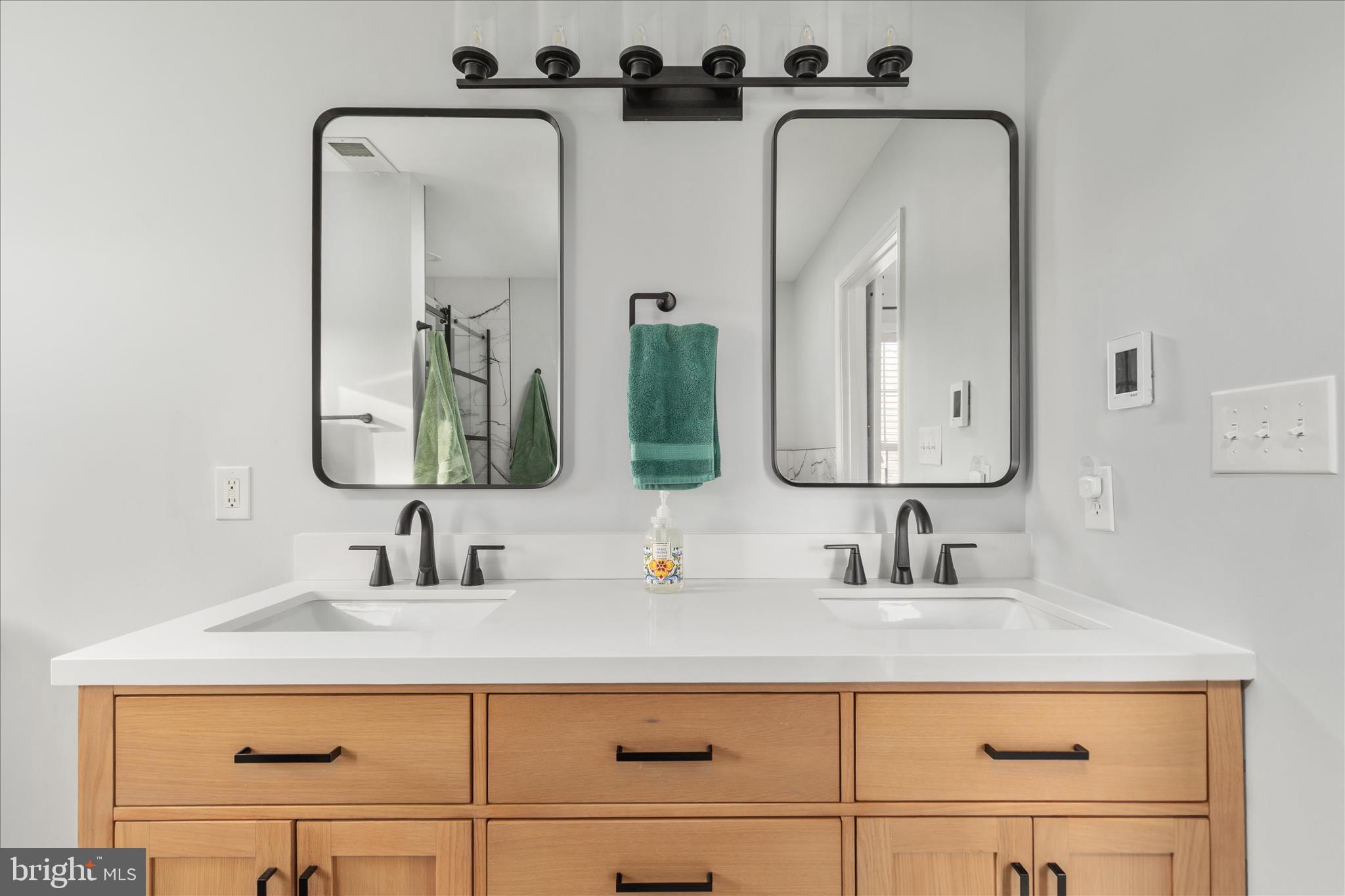 1161 Happy Ridge Drive Front Royal, VA 22630 - Photo 24 of 49 a bathroom with sink a mirror a vanity and