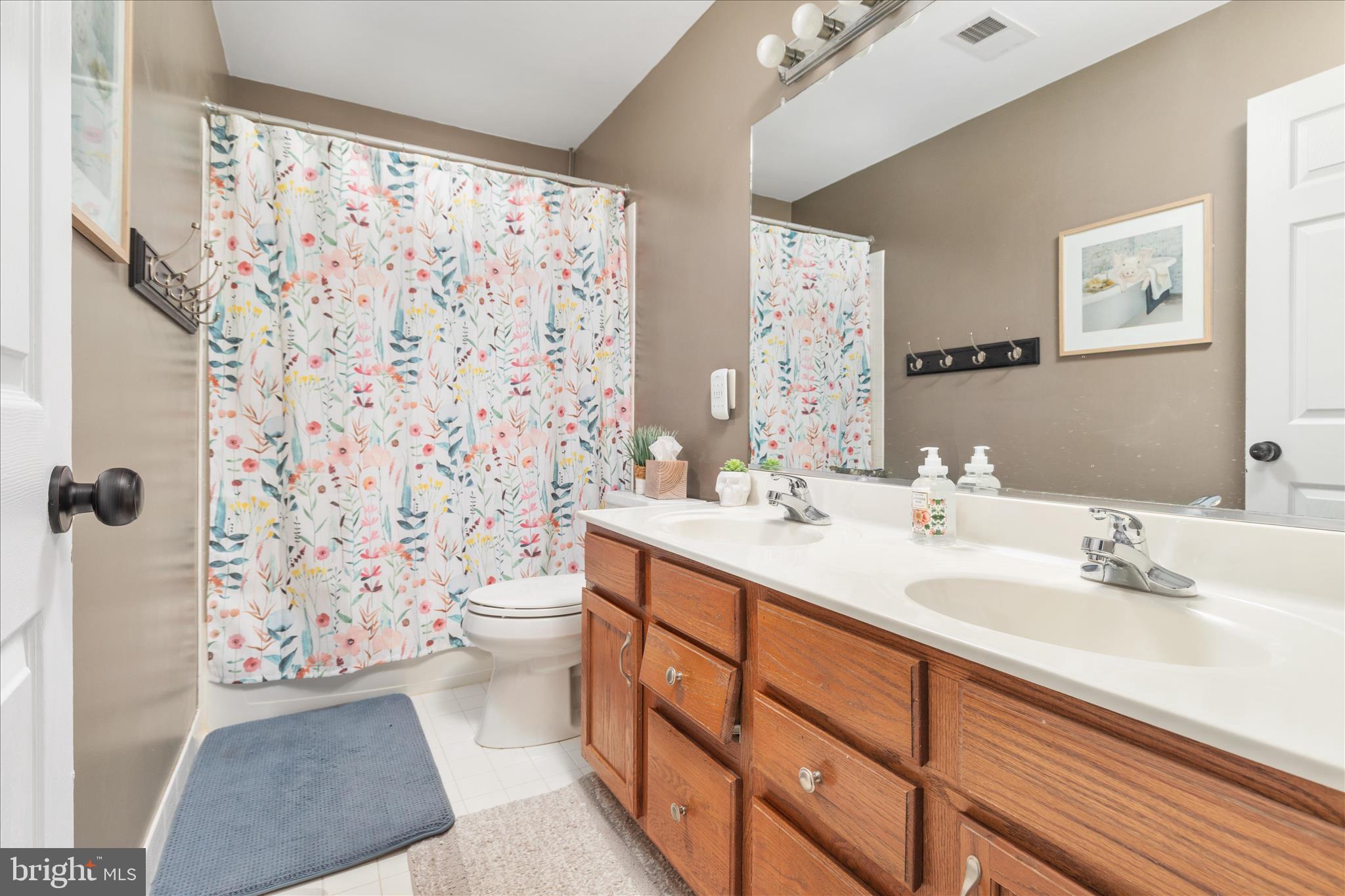 1161 Happy Ridge Drive Front Royal, VA 22630 - Photo 28 of 49 a bathroom with a double vanity sink toilet and shower