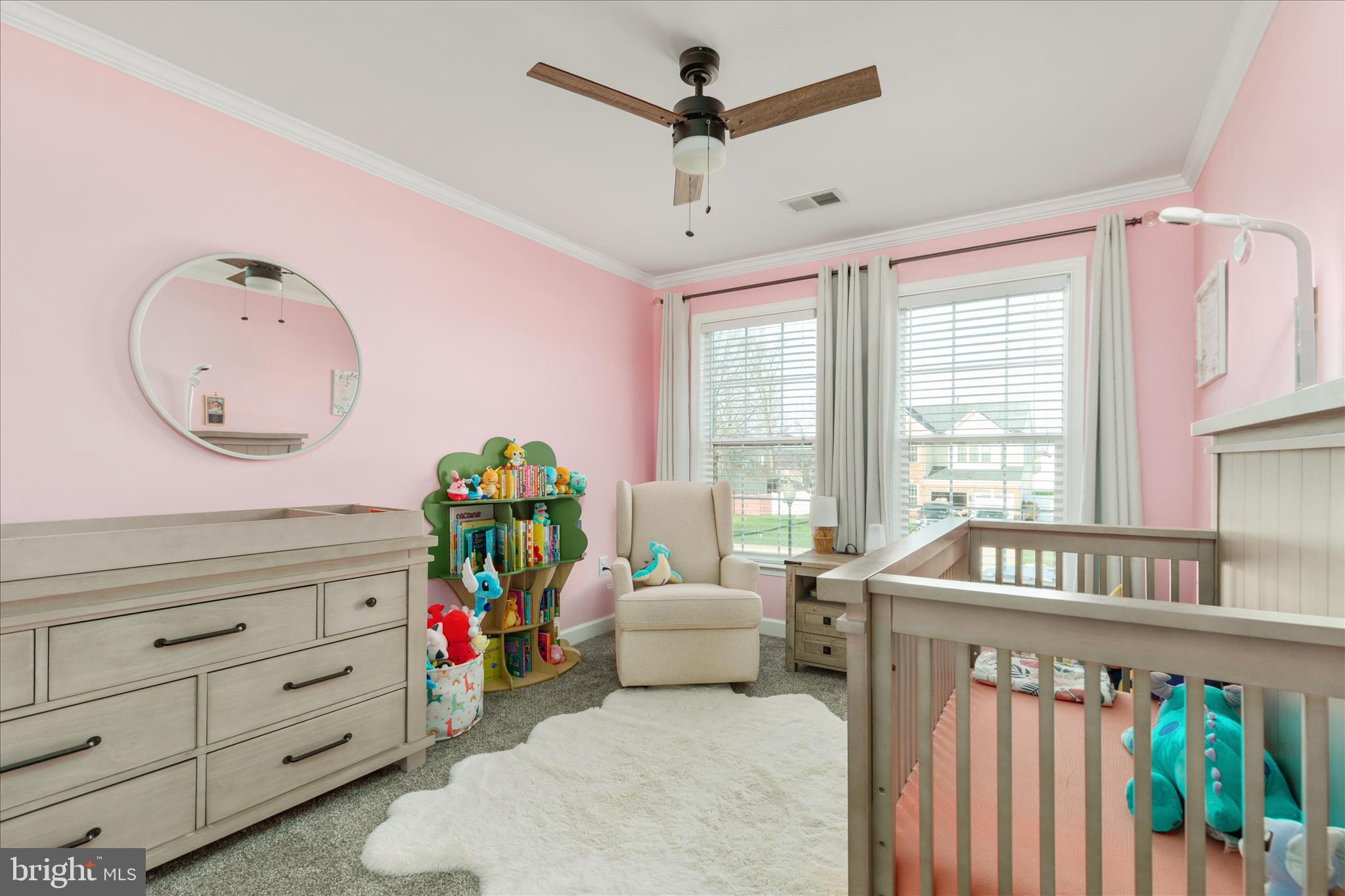 1161 Happy Ridge Drive Front Royal, VA 22630 - Photo 30 of 49 a living room with furniture a baby crib and a wooden floor
