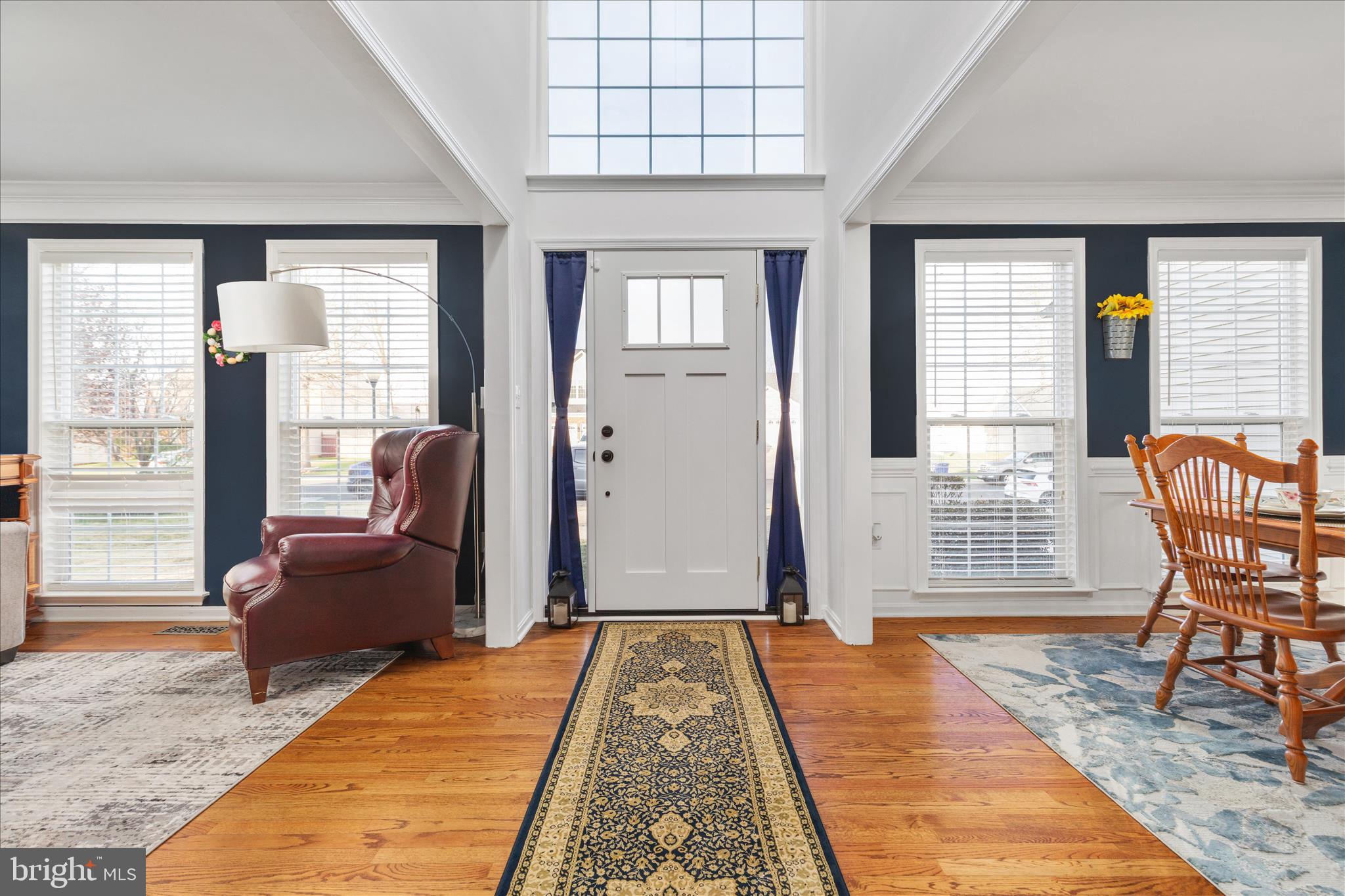 1161 Happy Ridge Drive Front Royal, VA 22630 - Photo 3 of 49 a bedroom with a bed a chair and next to a window