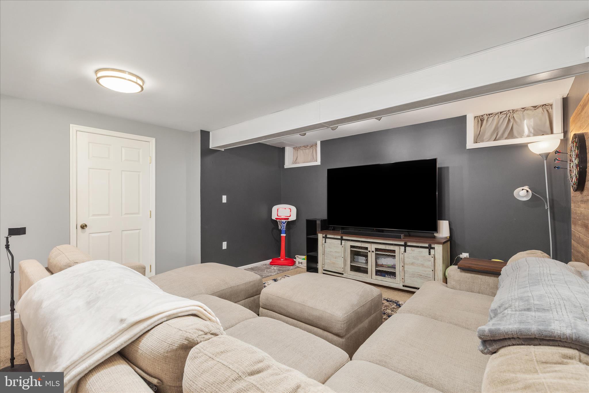 1161 Happy Ridge Drive Front Royal, VA 22630 - Photo 33 of 49 a living room with furniture and a flat screen tv