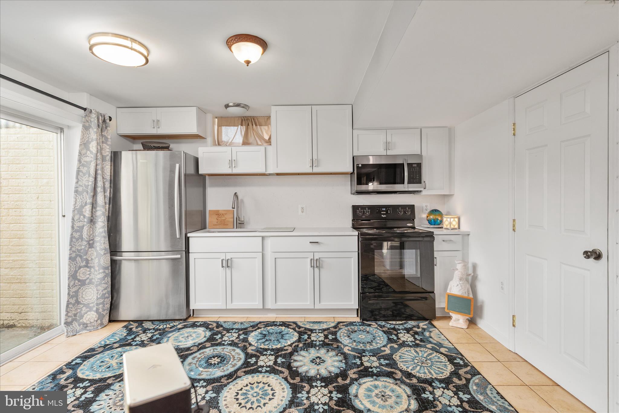 1161 Happy Ridge Drive Front Royal, VA 22630 - Photo 34 of 49 a kitchen with stainless steel appliances granite countertop a refrigerator stove and sink