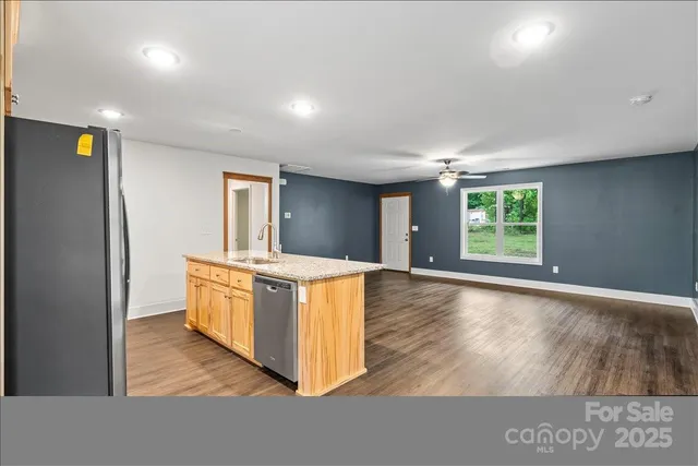 a view of kitchen with wooden floor