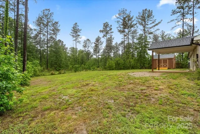 a front view of a house with yard