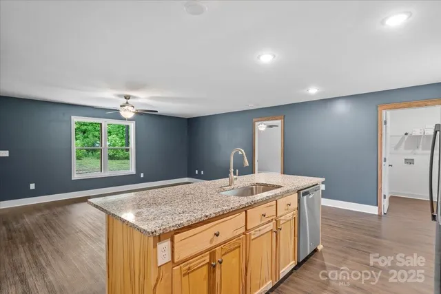 a kitchen with a stove a sink and a refrigerator