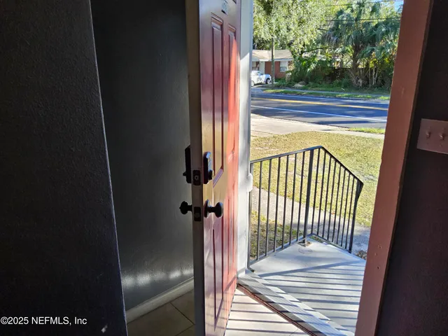 a view of a balcony from a door