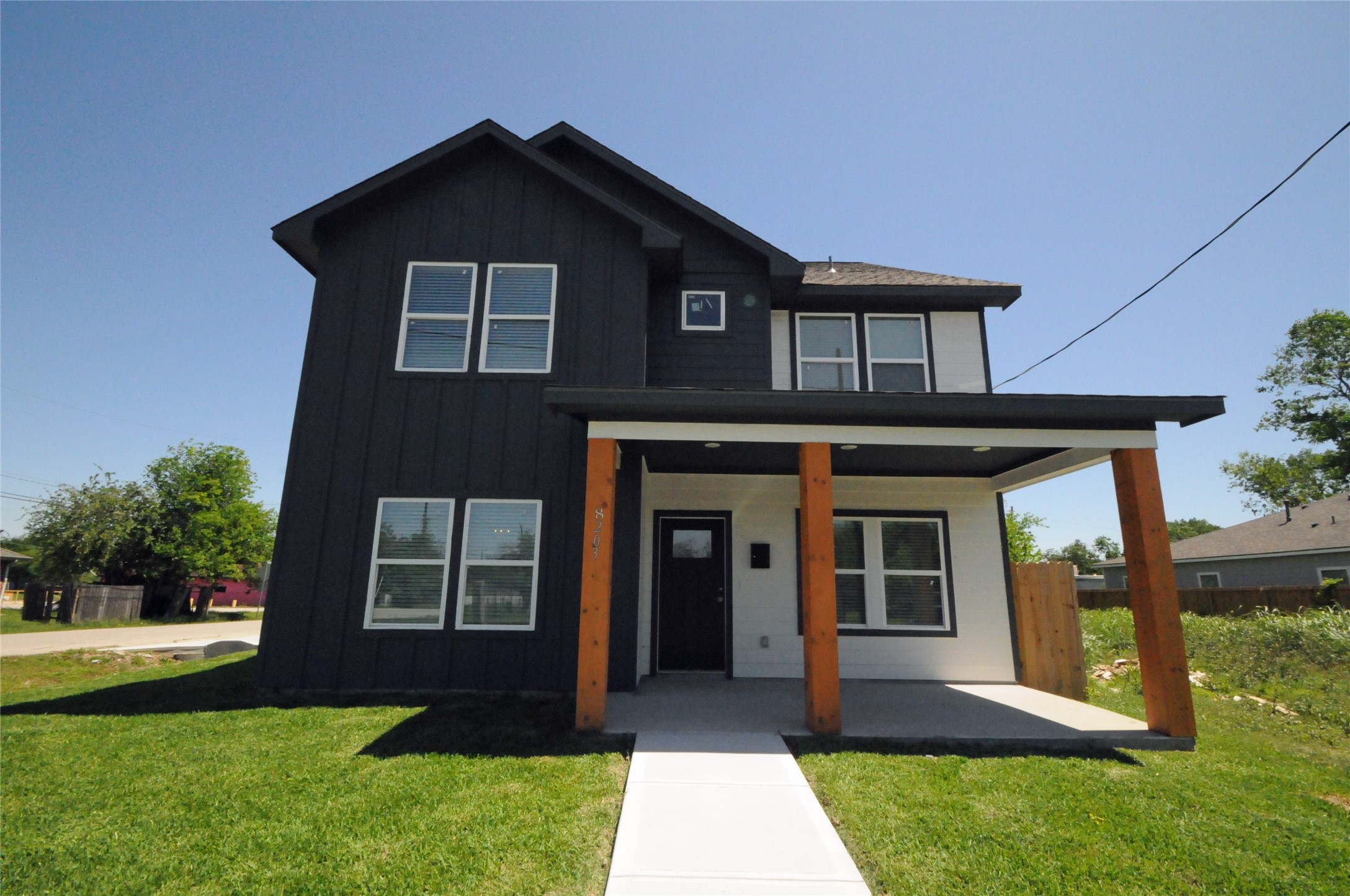 8203 Gladstone Street Houston, TX 77051 - Photo 1 of 41 a front view of a house with a yard