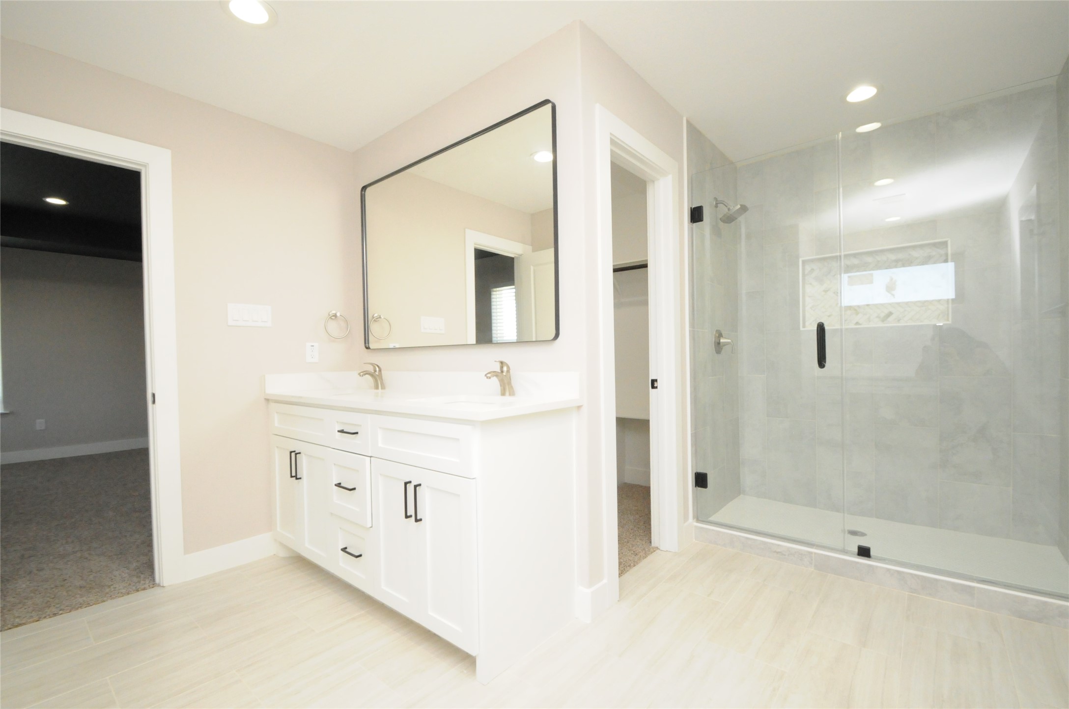 8203 Gladstone Street Houston, TX 77051 - Photo 26 of 41 a bathroom with a shower sink and mirror