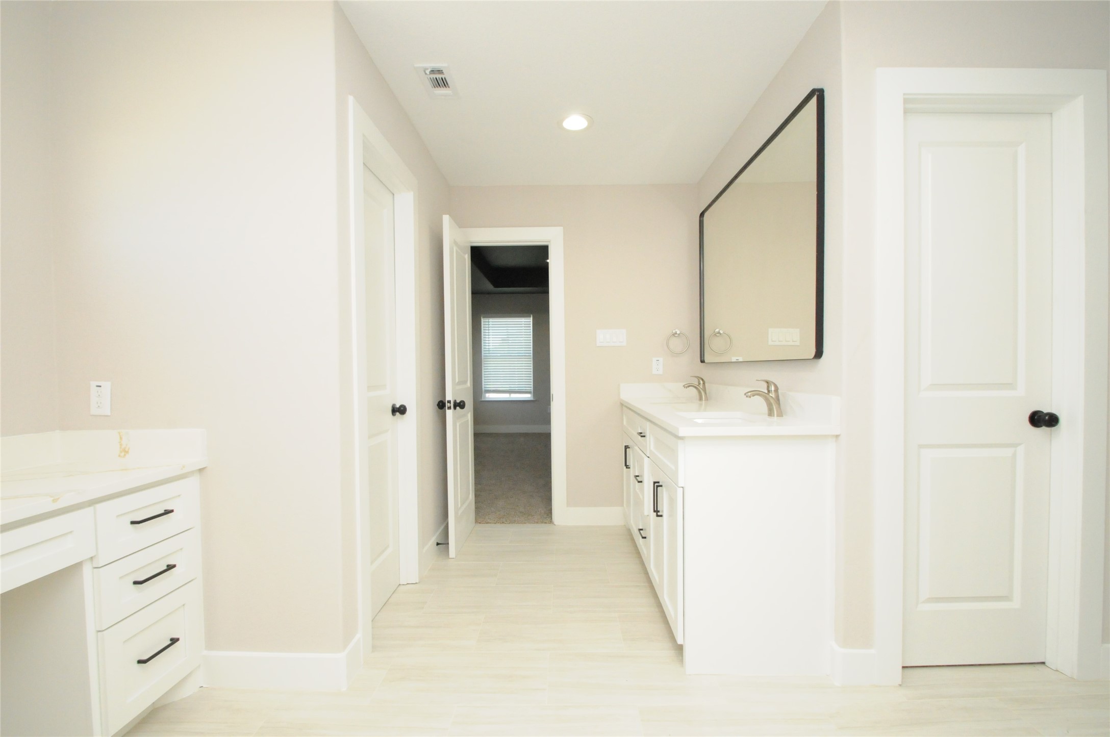 8203 Gladstone Street Houston, TX 77051 - Photo 28 of 41 a bathroom with a sink and a mirror