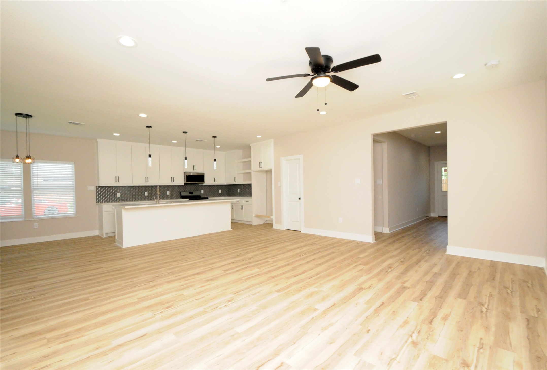8203 Gladstone Street Houston, TX 77051 - Photo 3 of 41 a view of a kitchen with a sink and a refrigerator