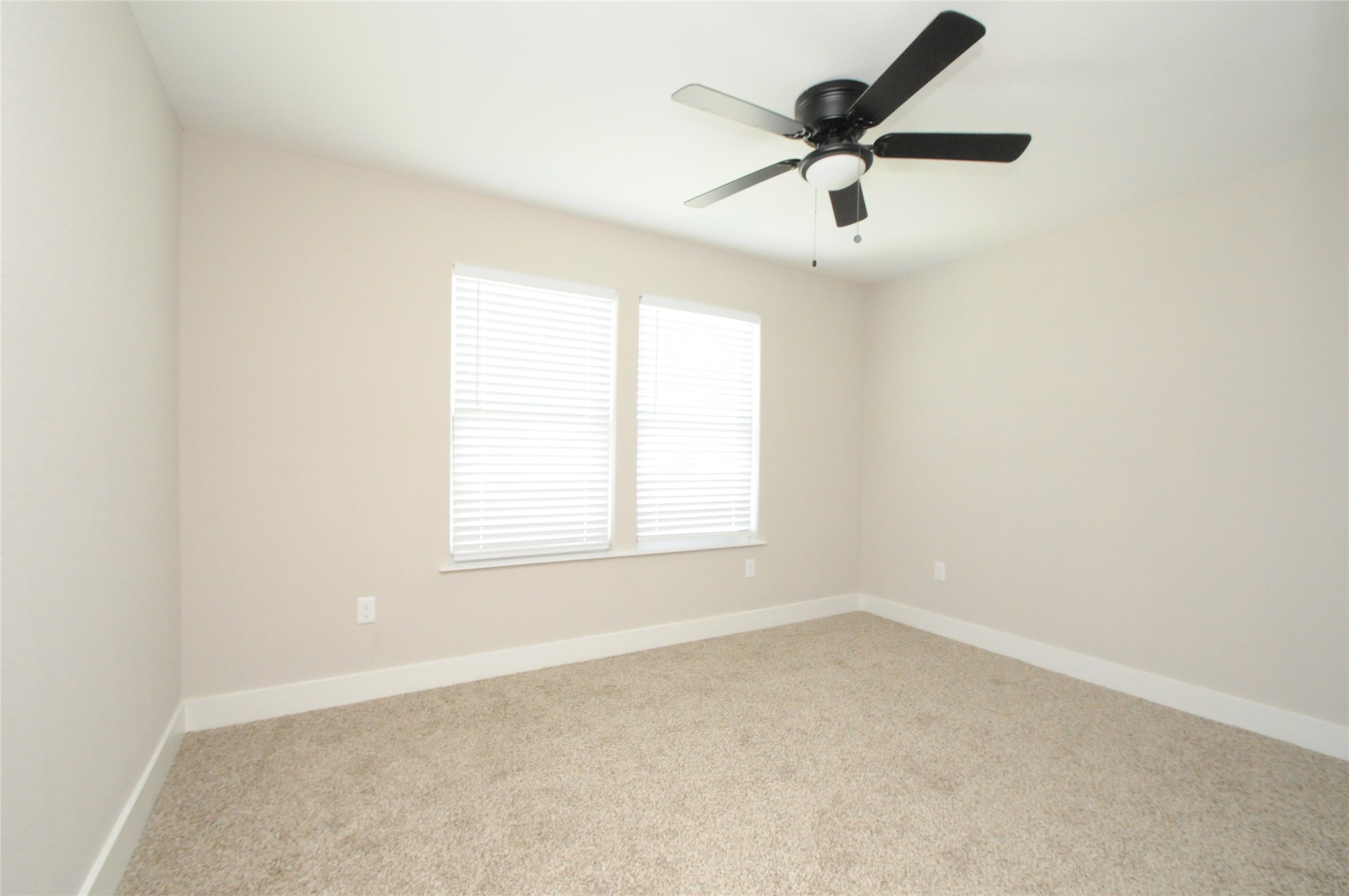 8203 Gladstone Street Houston, TX 77051 - Photo 38 of 41 an empty room with a window and a fan