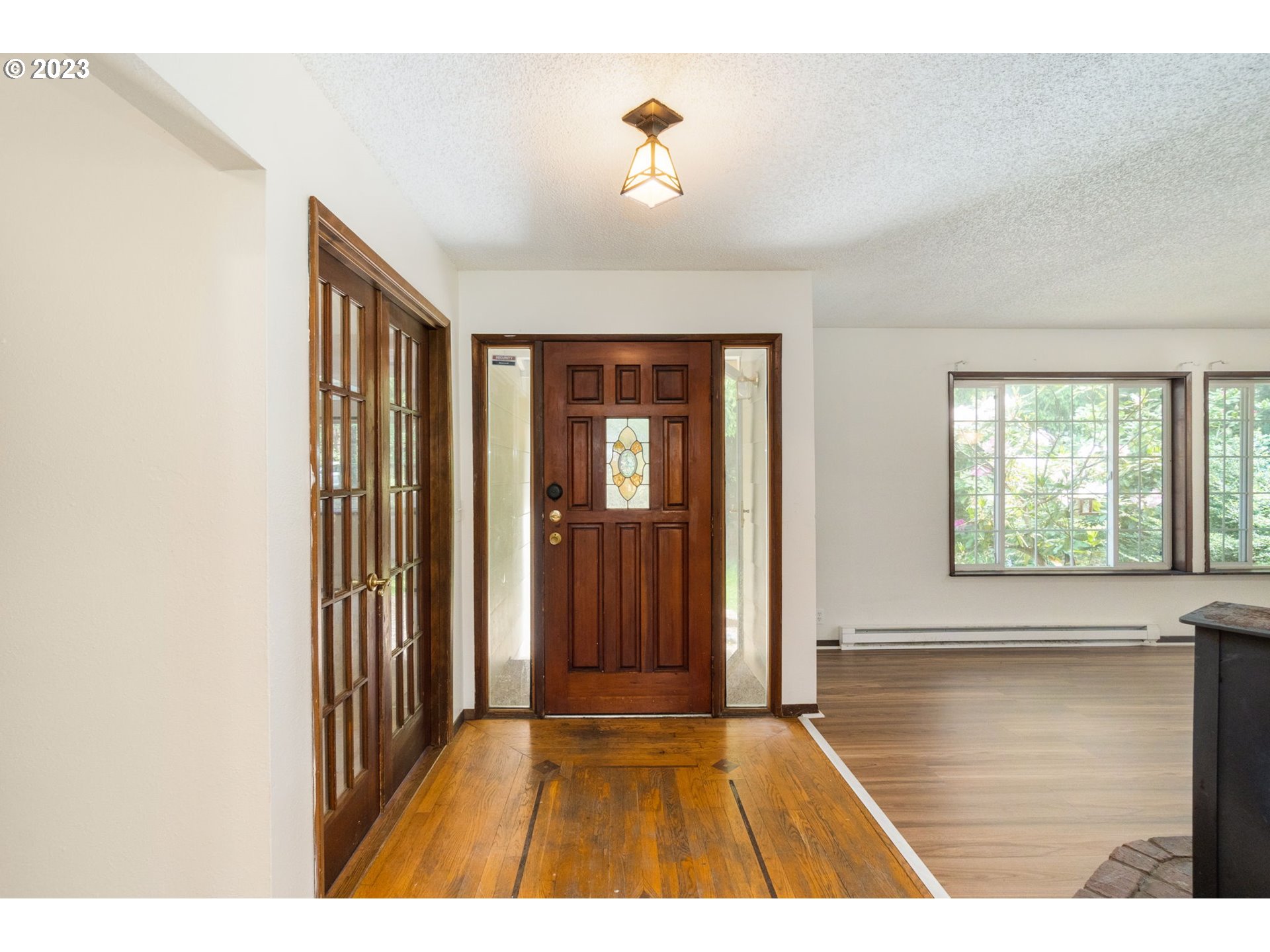 745 Southeast Littlepage Road Corbett, OR 97019 - Photo 11 of 39 a view interior of a house with wooden floor and a floor to ceiling window