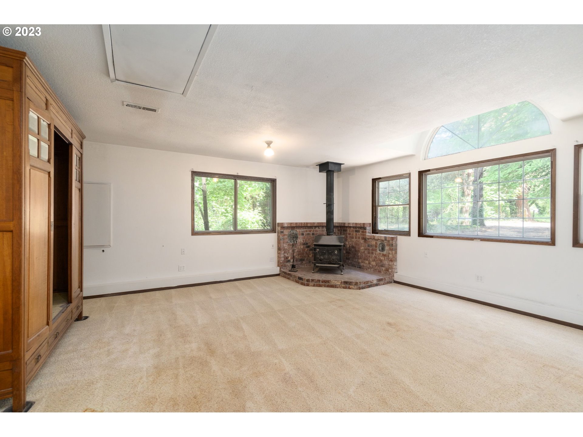 745 Southeast Littlepage Road Corbett, OR 97019 - Photo 12 of 39 a living room with furniture and a flat screen tv