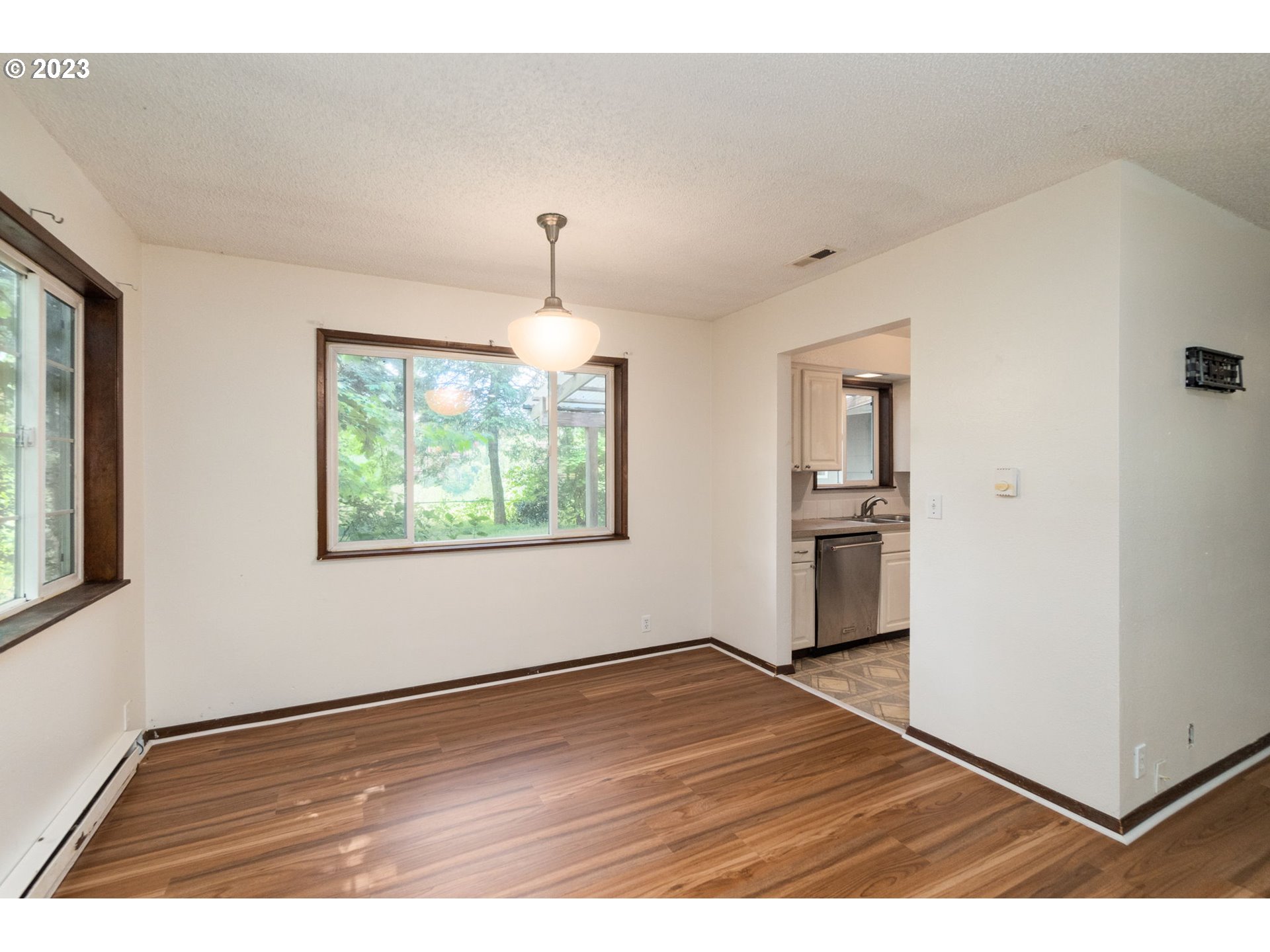 745 Southeast Littlepage Road Corbett, OR 97019 - Photo 7 of 39 a view of empty room with wooden floor and window