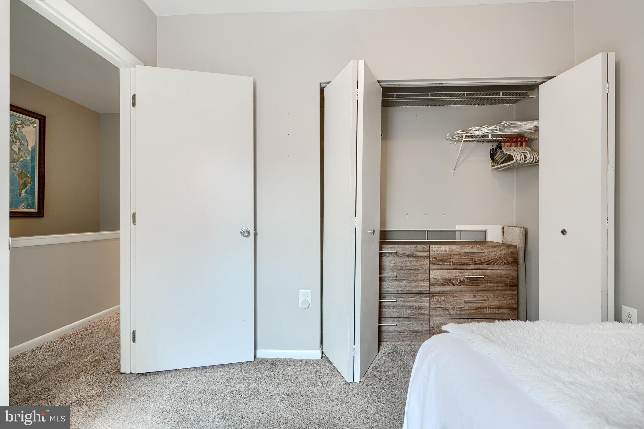 123 West Barre Street, Unit 103 Baltimore, MD 21201 - Photo 13 of 26 a bedroom with a bed and cabinets