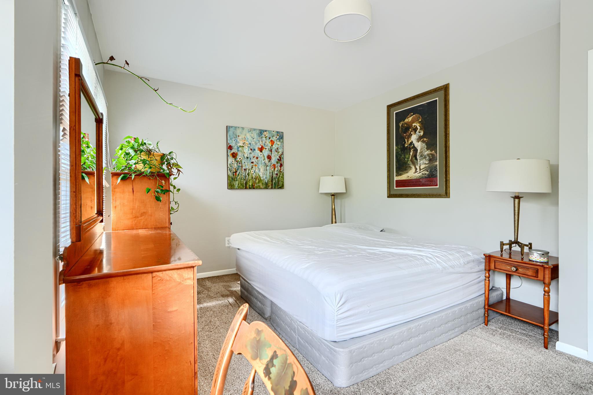 123 West Barre Street, Unit 103 Baltimore, MD 21201 - Photo 16 of 26 a bedroom with a bed and a dresser