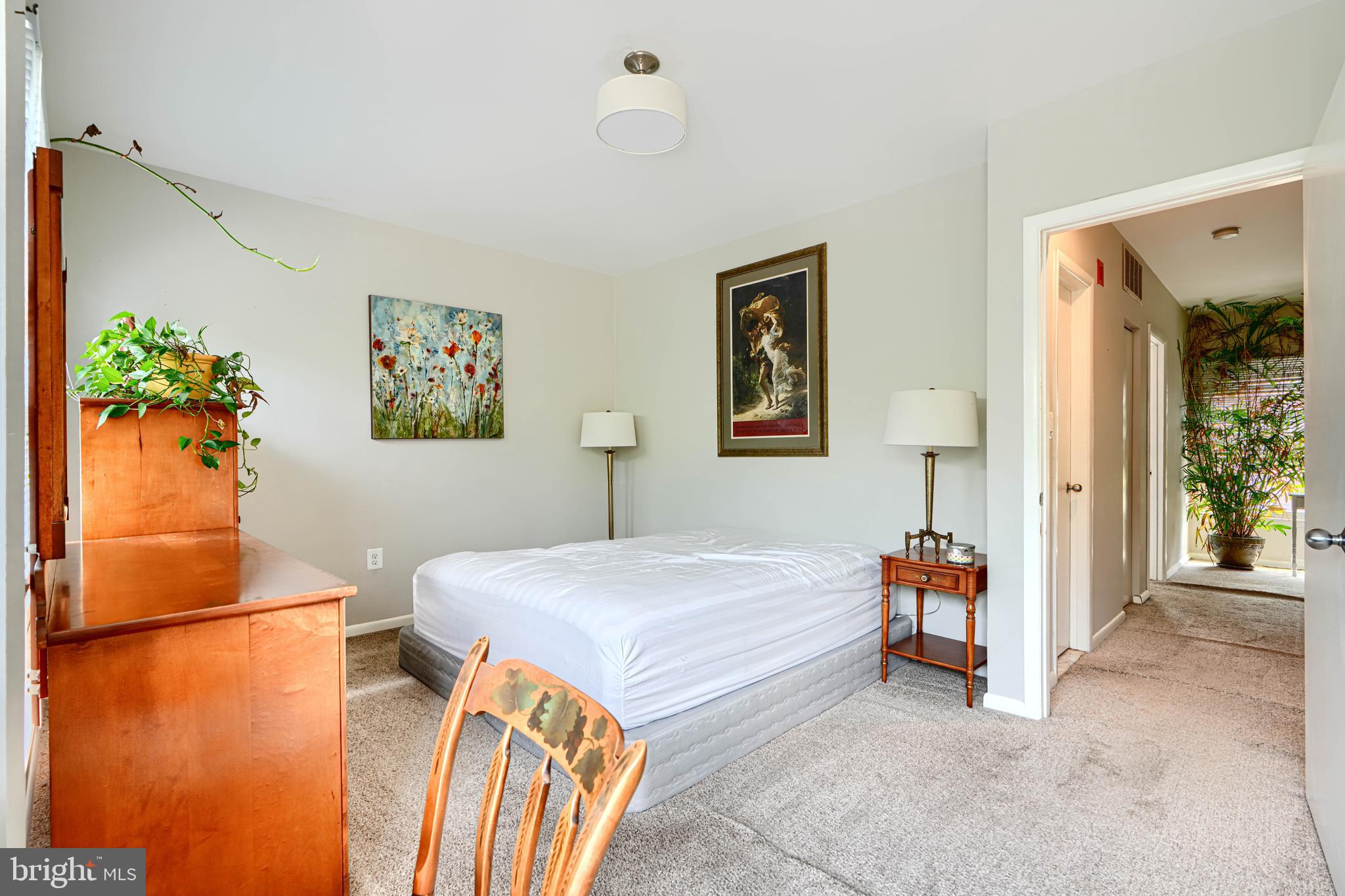 123 West Barre Street, Unit 103 Baltimore, MD 21201 - Photo 17 of 26 a bedroom with a bed and a table in it