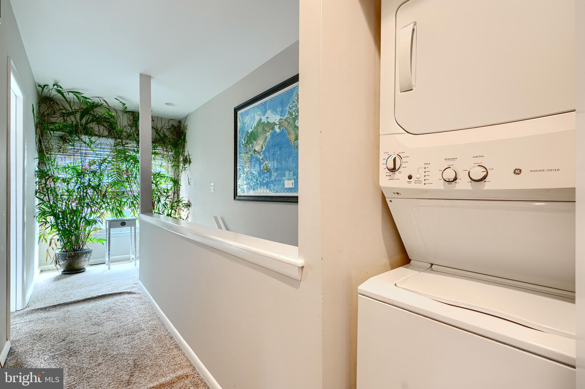 123 West Barre Street, Unit 103 Baltimore, MD 21201 - Photo 19 of 26 a view of washer and dryer with bathroom in the background