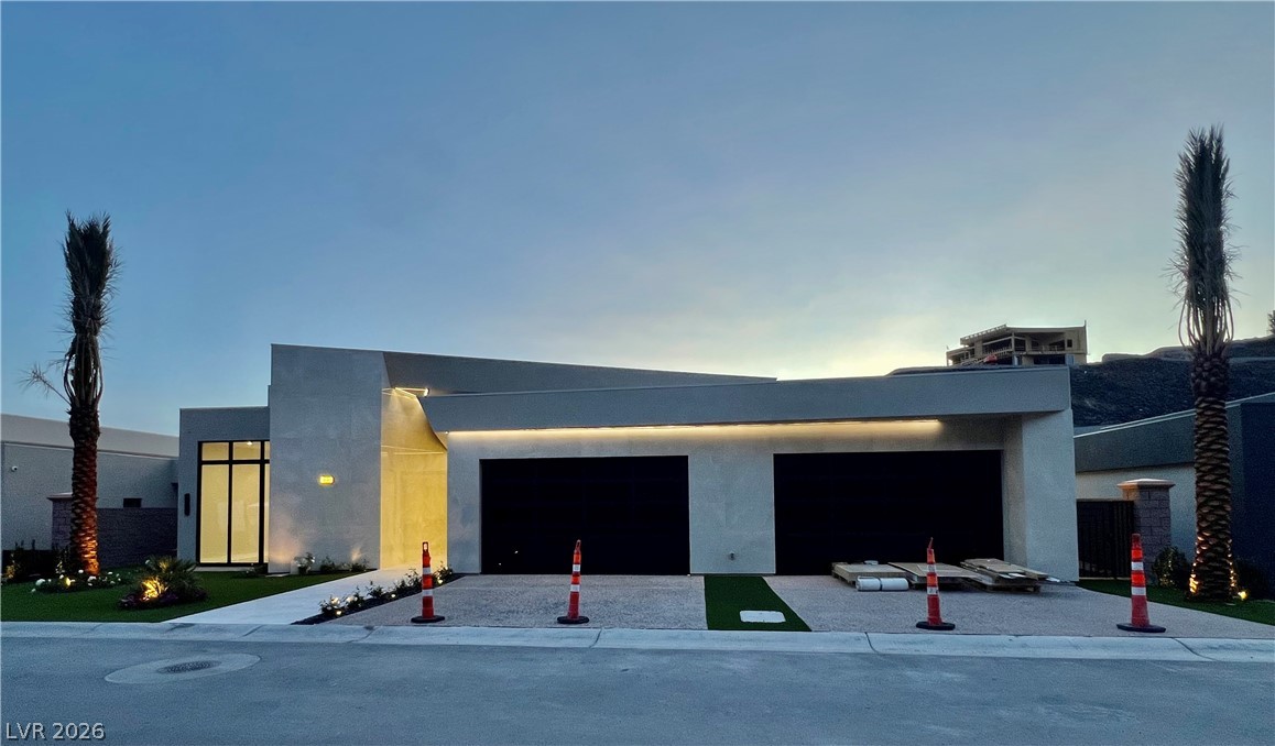 491 Cityview Ridge Drive Henderson, NV 89012 - Photo 1 of 24 Front of House with Palm Trees, Black rocks under white Roses