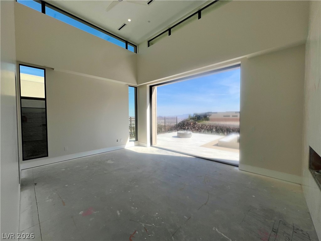 491 Cityview Ridge Drive Henderson, NV 89012 - Photo 6 of 24 Pocket doors to pool/spa/fire lounge