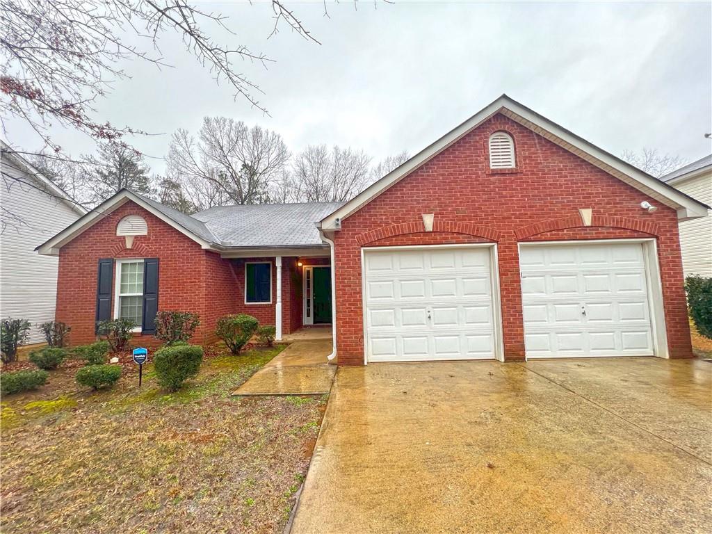 3279 River Run Trail Decatur, GA 30034 - Photo 1 of 1 a front view of a house with garden