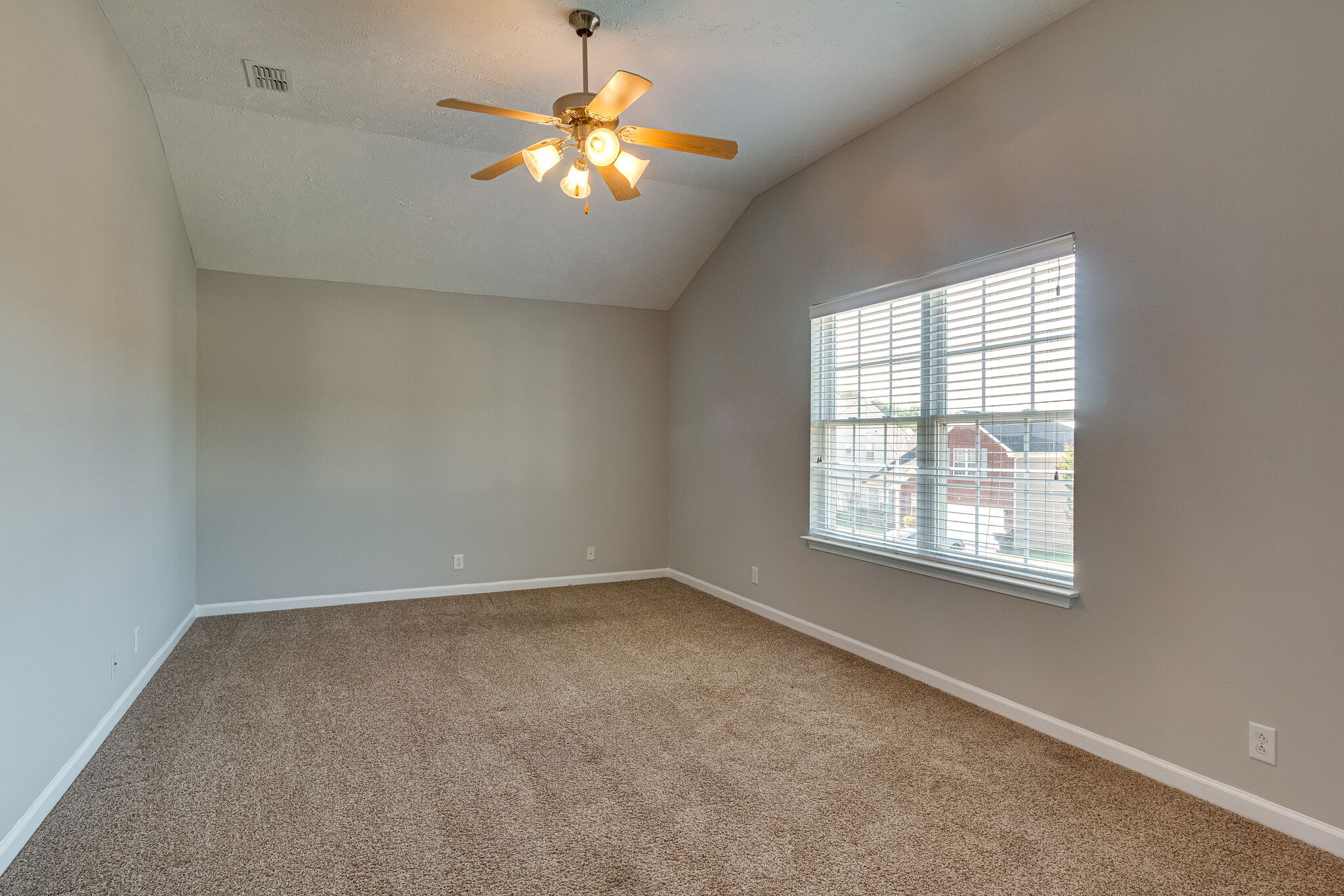 611 Buck Cherry Way Murfreesboro, TN 37128 - Photo 20 of 36 an empty room with a chandelier fan and window