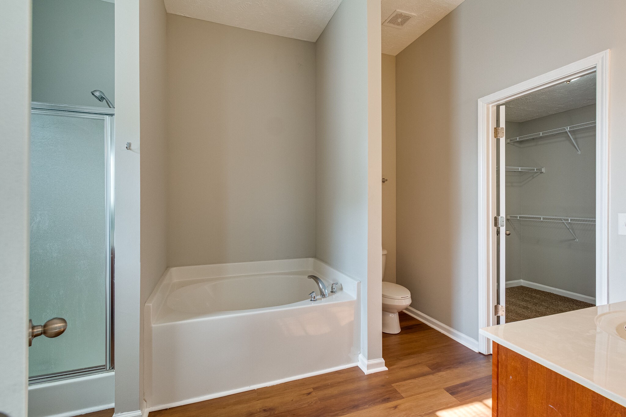 611 Buck Cherry Way Murfreesboro, TN 37128 - Photo 25 of 36 a white bath tub sitting next to a small bathroom