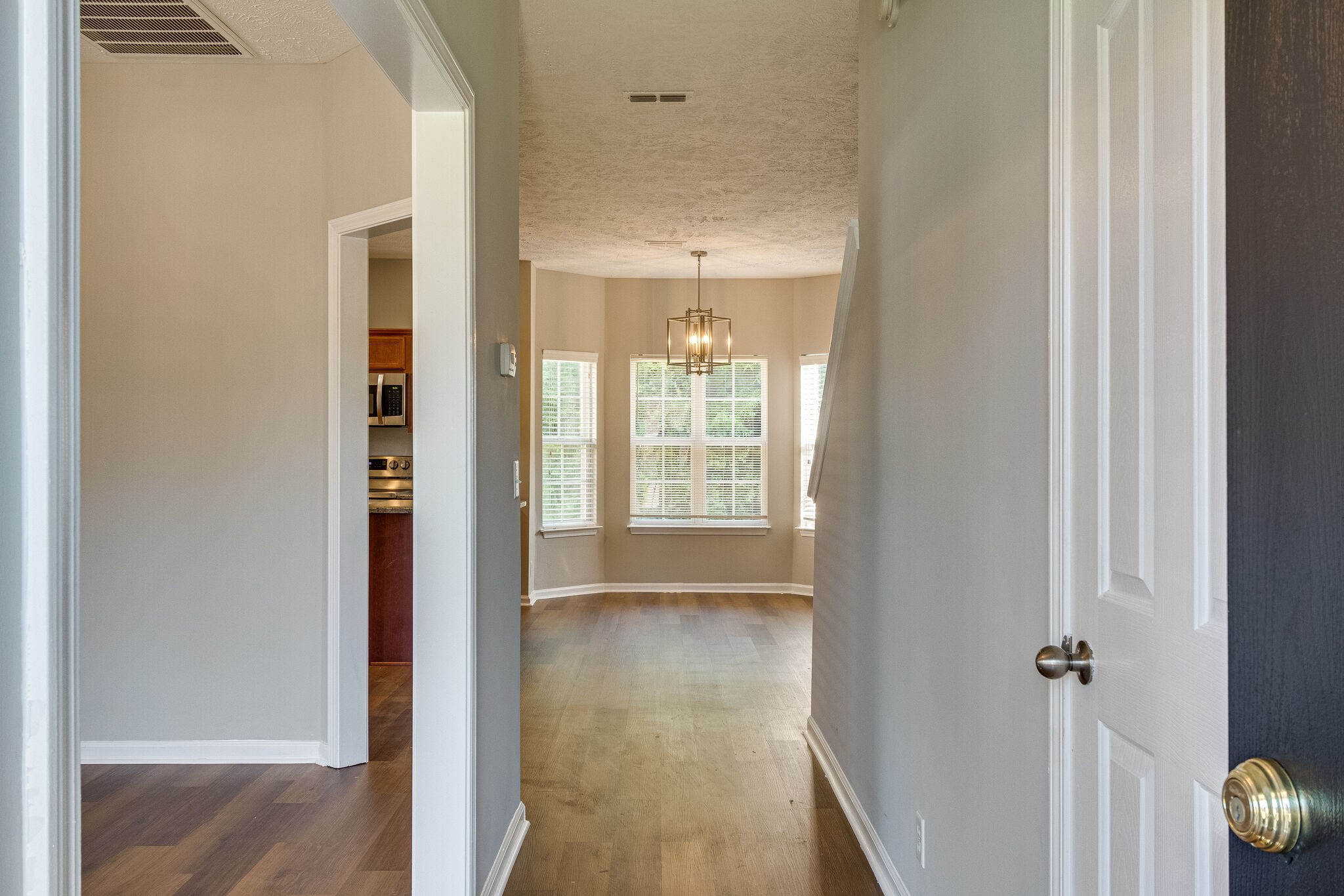 611 Buck Cherry Way Murfreesboro, TN 37128 - Photo 6 of 36 a view of a hallway with wooden floor and closet area