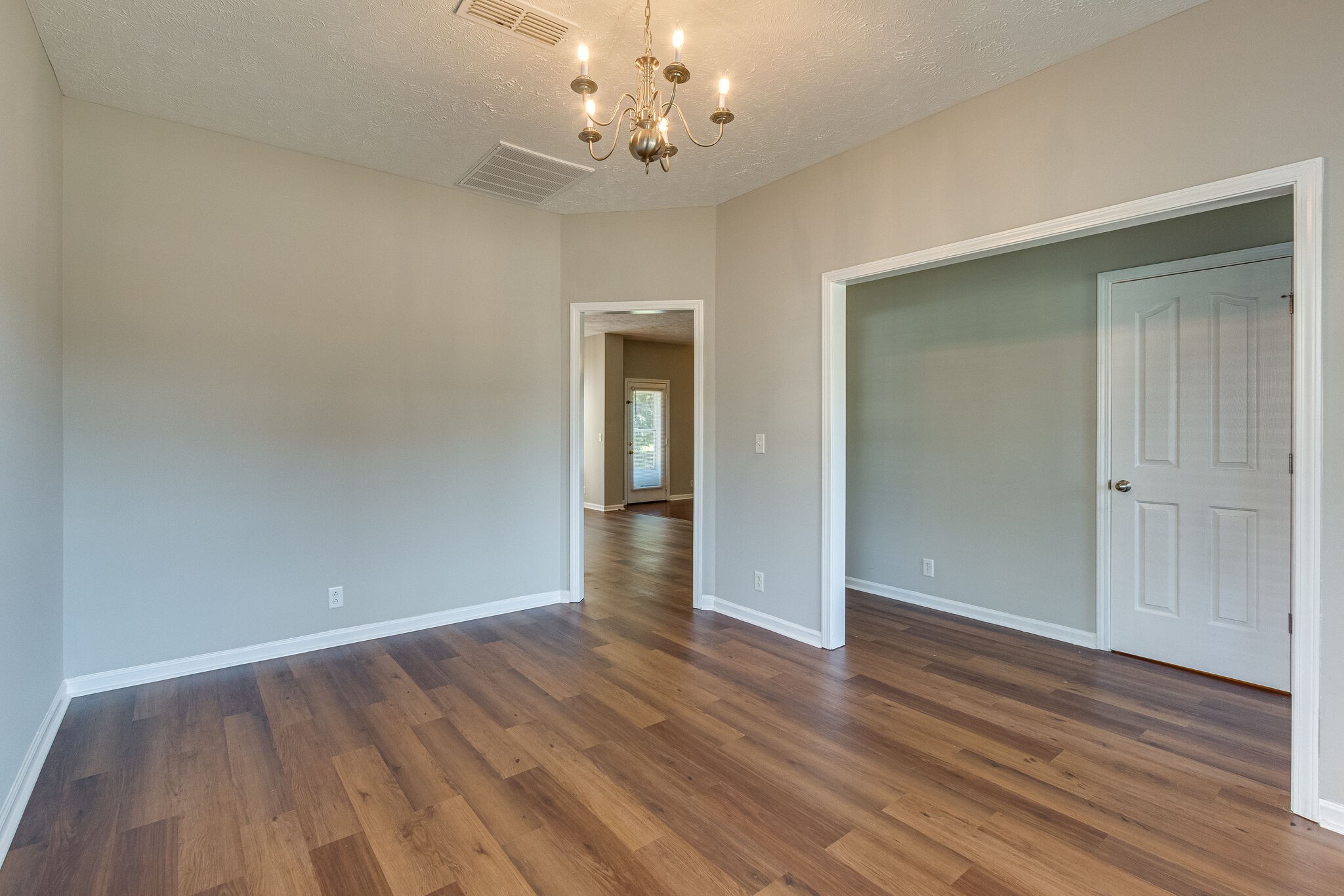 611 Buck Cherry Way Murfreesboro, TN 37128 - Photo 8 of 36 a view of an empty room with wooden floor