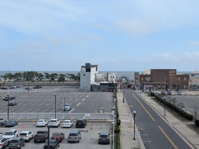 a front view of a building with parking