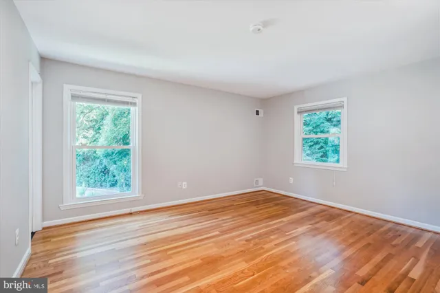 a view of entryway with wooden floor and stairs