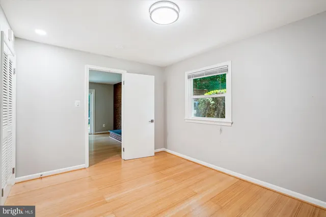 a view of a house with a yard and pathway