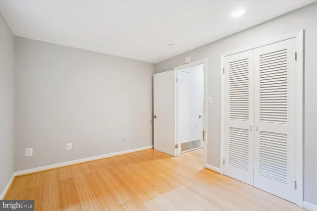 a view of house with backyard and outdoor seating