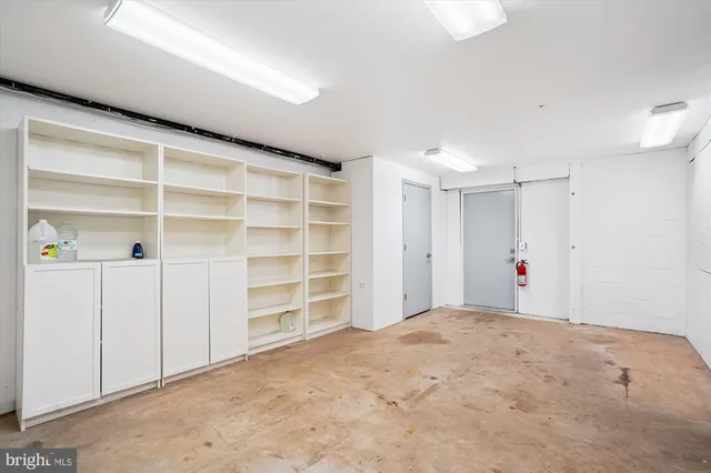 a view of a house with a yard and garage