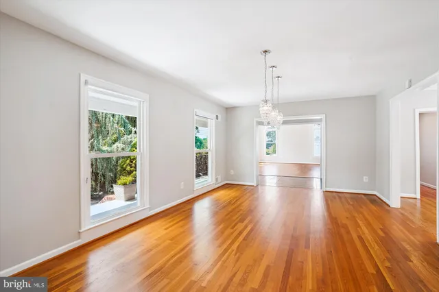 a kitchen with stainless steel appliances granite countertop a refrigerator a stove and a sink