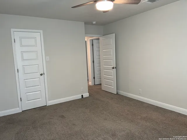 an empty room with closet area