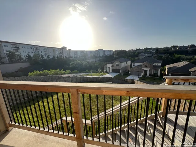 a balcony with an outdoor space
