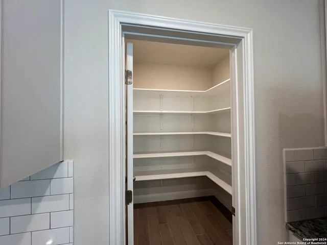 a storage room with a wooden floor