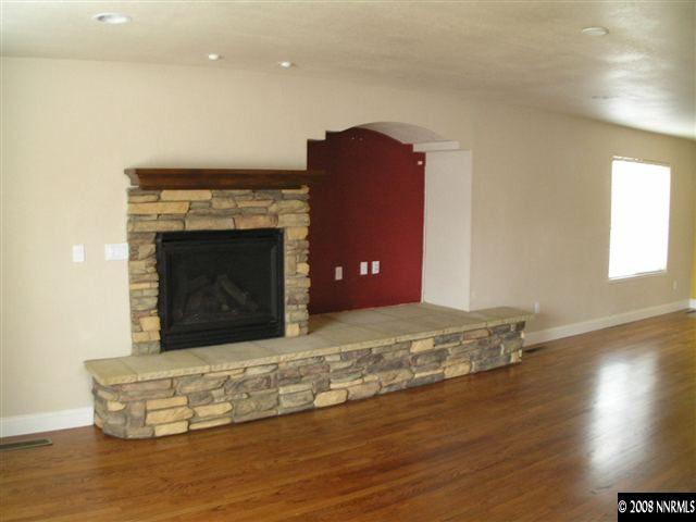 30 Kaye Way Reno, NV 89509 - Photo 3 of 7 a living room with a fireplace