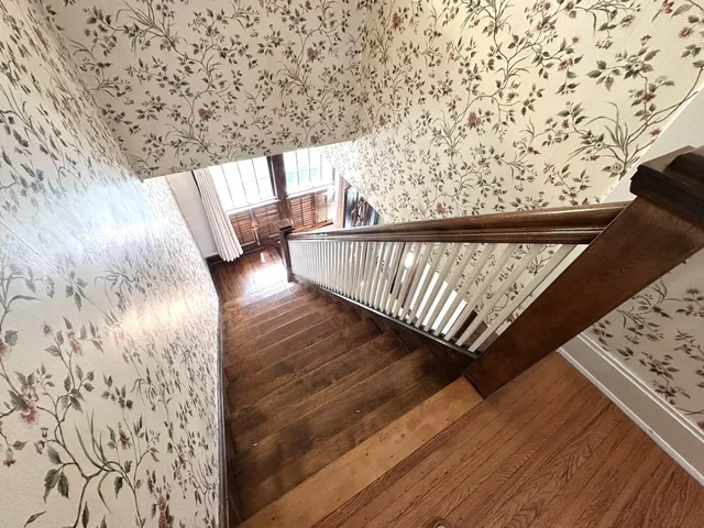 a view of gallery with wooden floor