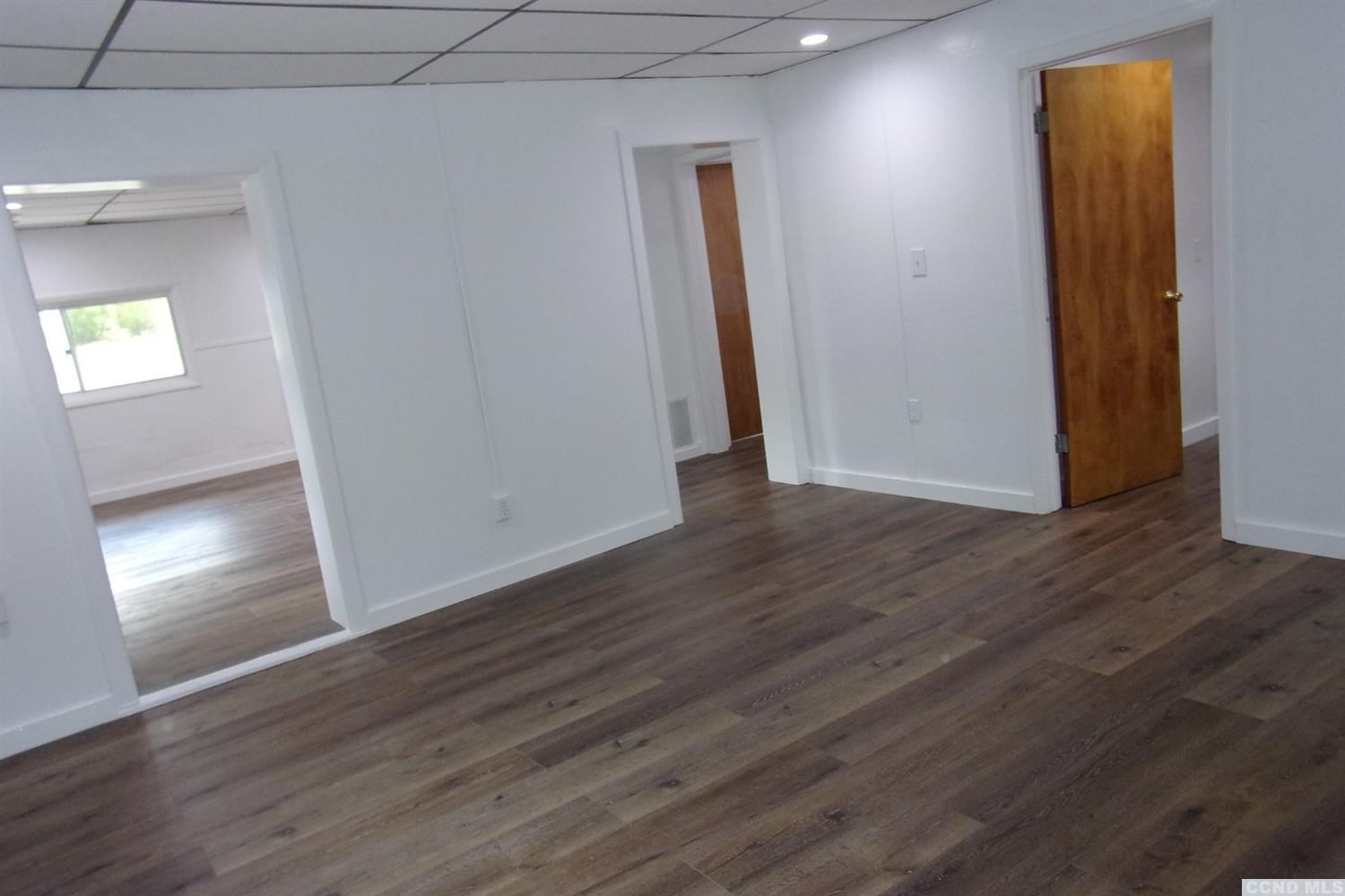 336 Main Street Cairo, NY 12413 - Photo 12 of 15 an empty room with wooden floor and windows