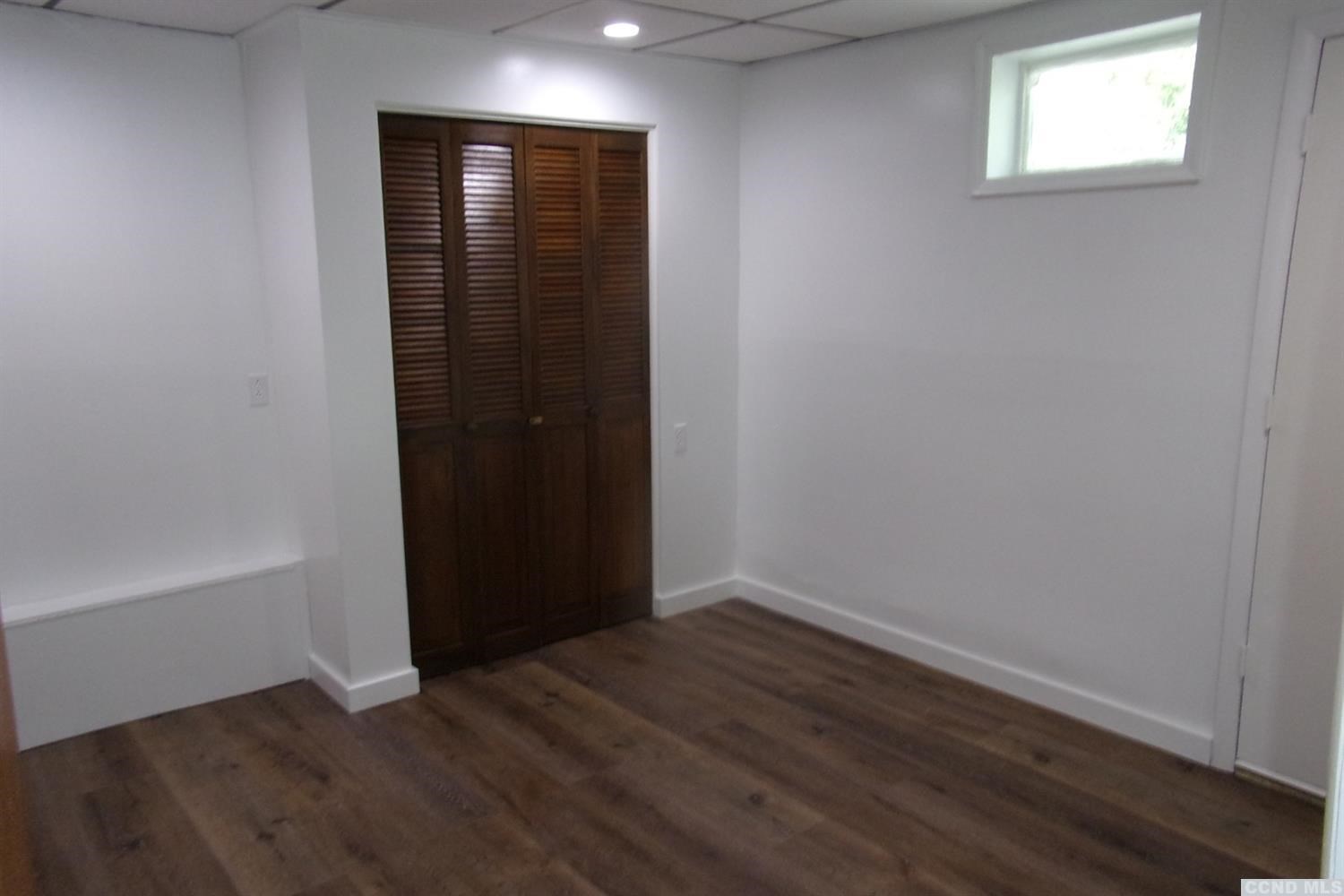 336 Main Street Cairo, NY 12413 - Photo 14 of 15 an empty room with wooden floor and closet