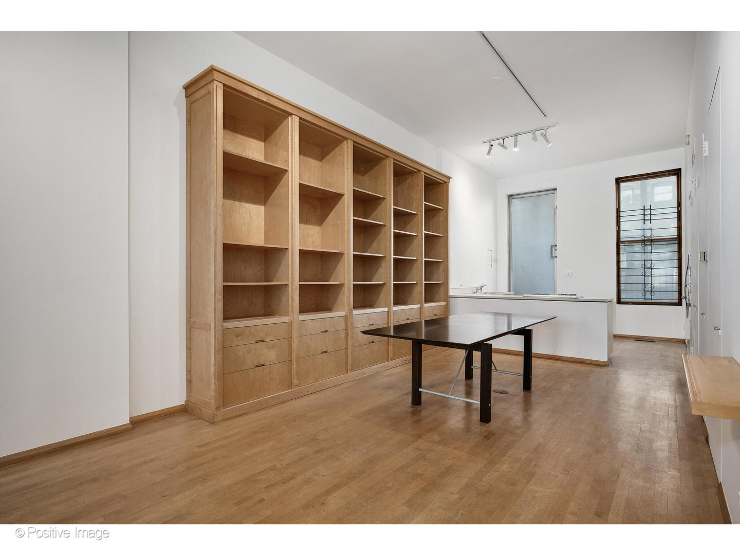 740 North Wells Street Chicago, IL 60654 - Photo 15 of 47 a view of an empty room with a window and wooden floor