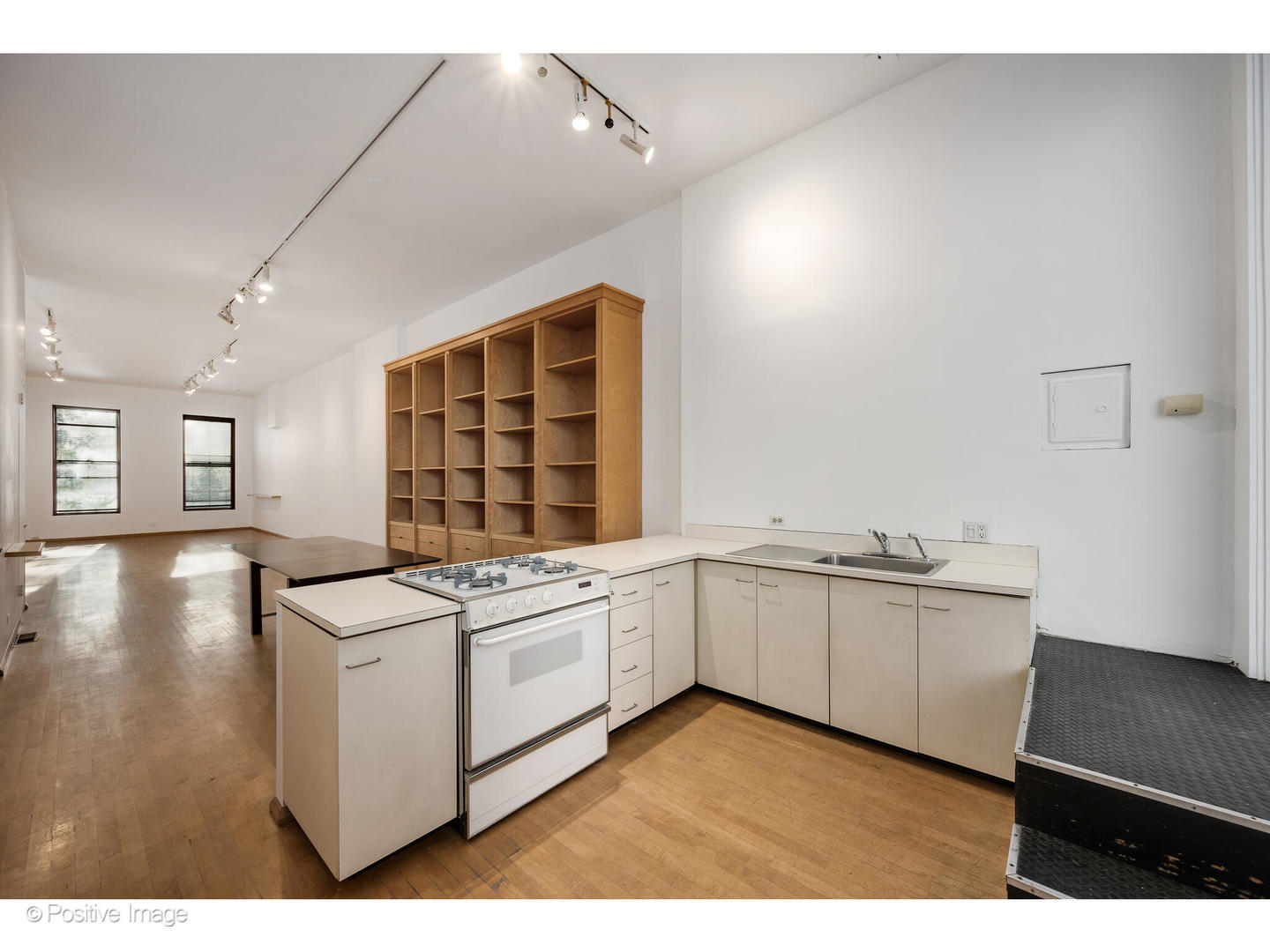 740 North Wells Street Chicago, IL 60654 - Photo 18 of 47 a kitchen with stainless steel appliances granite countertop a stove and white cabinets