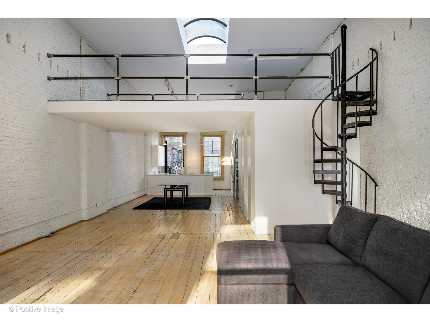 740 North Wells Street Chicago, IL 60654 - Photo 26 of 47 a living room with furniture and wooden floor