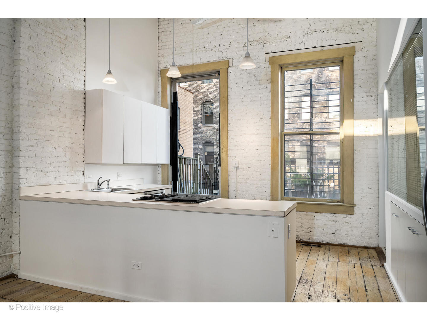 740 North Wells Street Chicago, IL 60654 - Photo 33 of 47 a view of a bathroom with a sink a mirror and a window
