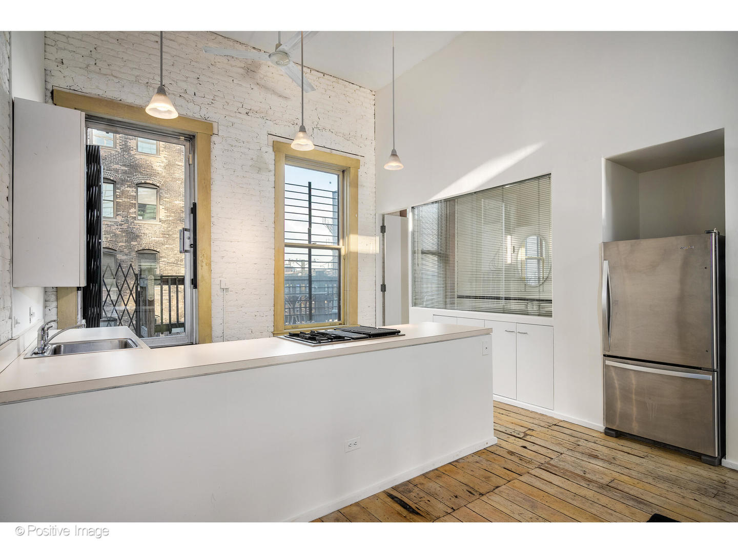 740 North Wells Street Chicago, IL 60654 - Photo 34 of 47 a kitchen with granite countertop a refrigerator and a sink