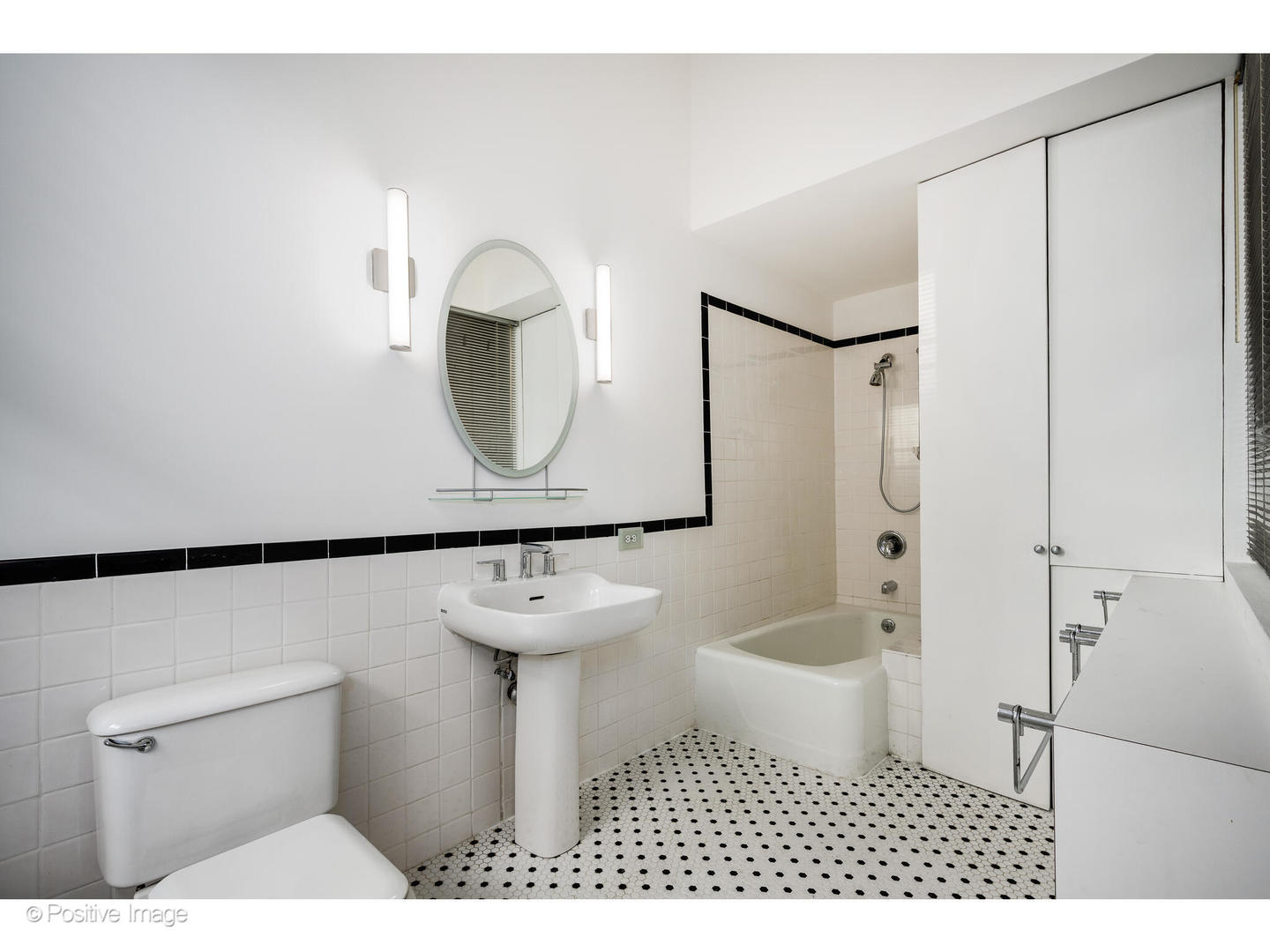 740 North Wells Street Chicago, IL 60654 - Photo 37 of 47 a bathroom with a sink a toilet and shower